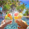 Couple pool icecream holiday travel