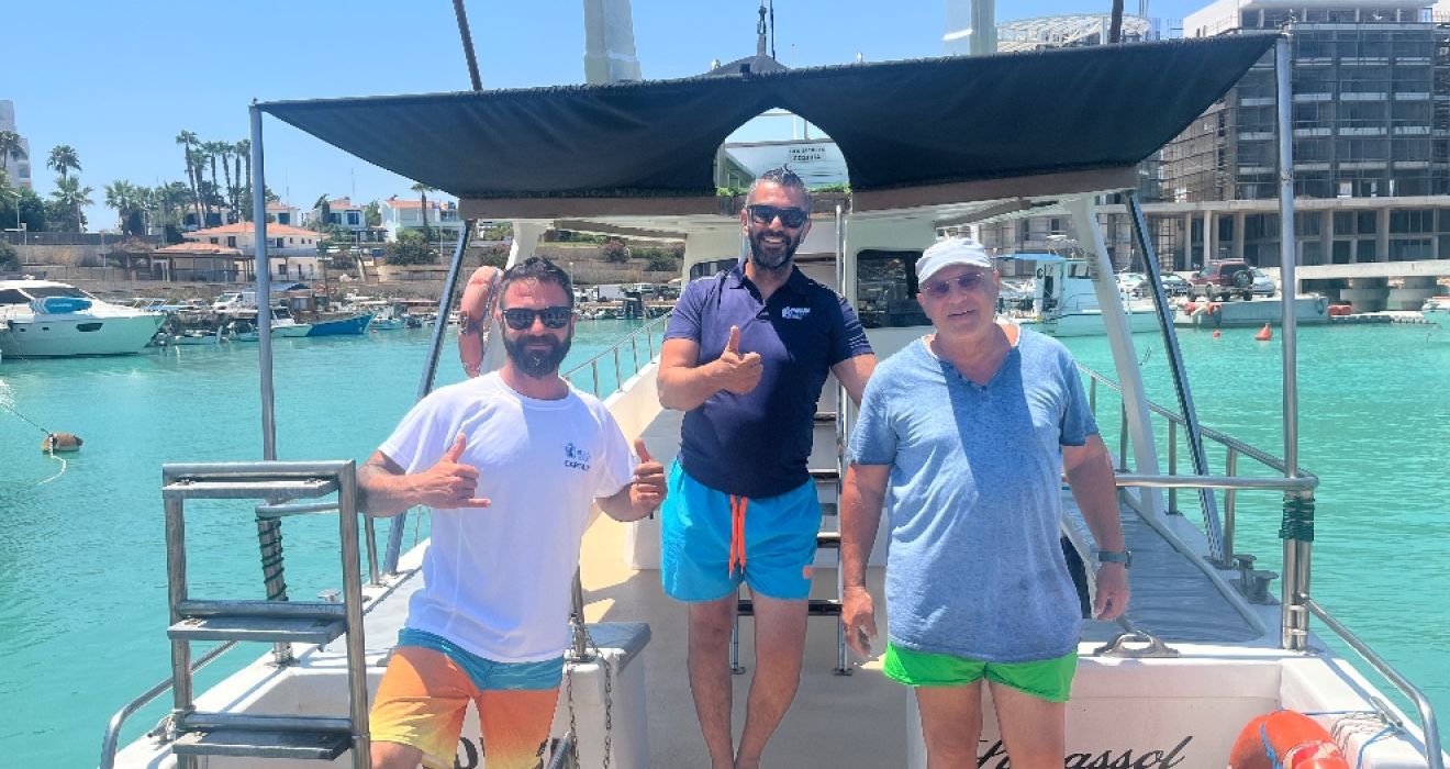 A boat crew give the thumbs up