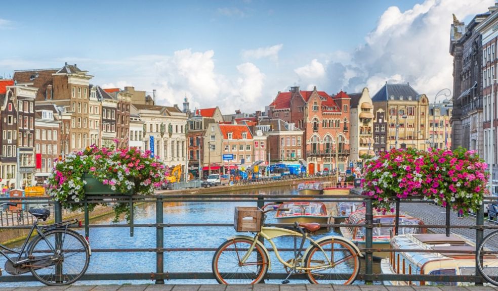 Amsterdam canal flowers bike bridge travel