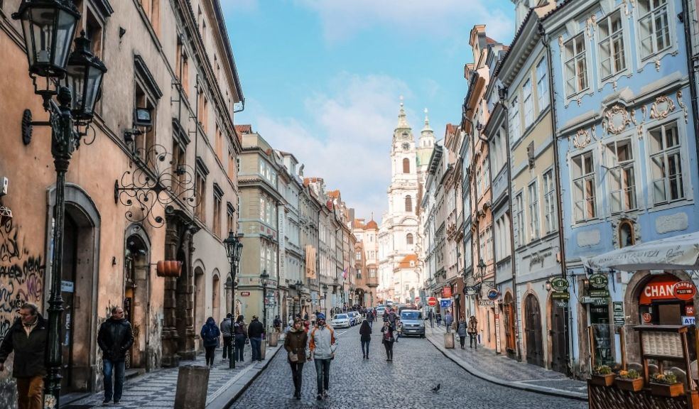 people awlking on a street in Europe in daylight