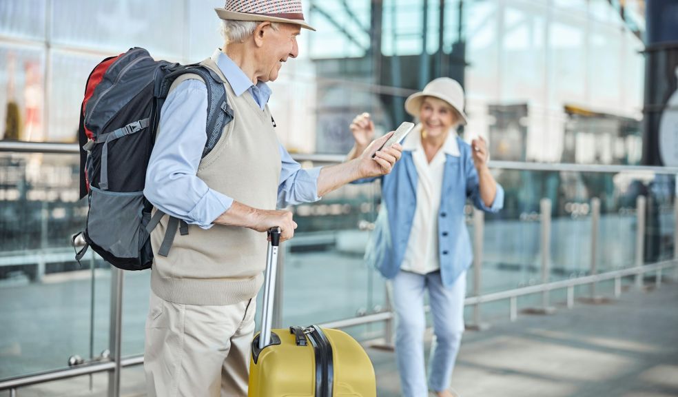 senior couple at airport and ready to go on vacation