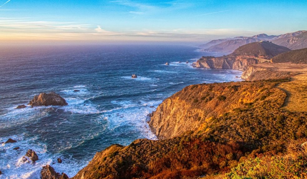 a body of water and cliff