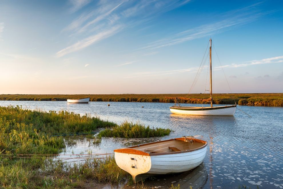 Boats on salt marshes at Blakeney, north Norfolk Coast, road trip, travel