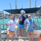 A boat crew give the thumbs up