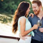 Happy smiling couple in love dancing and flirting outdoor