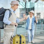 senior couple at airport and ready to go on vacation
