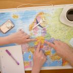 planning for a holiday people pointing at map