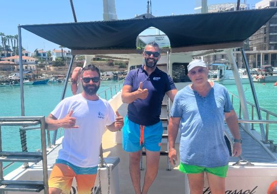 A boat crew give the thumbs up