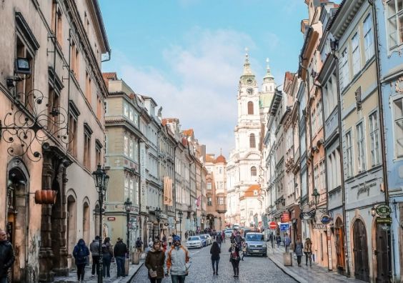 people awlking on a street in Europe in daylight