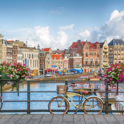 Amsterdam canal flowers bike bridge travel Amsterdam canal flowers bike bridge travel