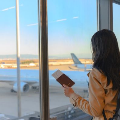 Women airport passport plane extreme day trip travel insurance