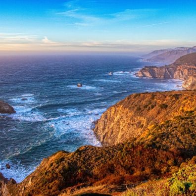 a body of water and cliff 