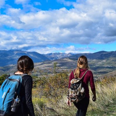 two girls walking over moorland