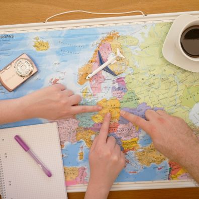 planning for a holiday people pointing at map