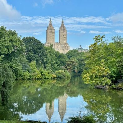 a lake surrounded by skyscrapers in New York